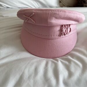 Ruslan Baginskiy hat in pink.